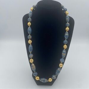 Elegant Blue and Gold Necklace with Rhythmic Bead Pattern
